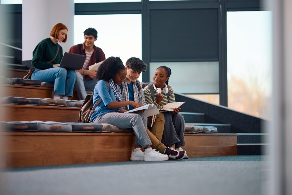 Group,of,students,learning,together,at,college,amphitheater.,copy,space