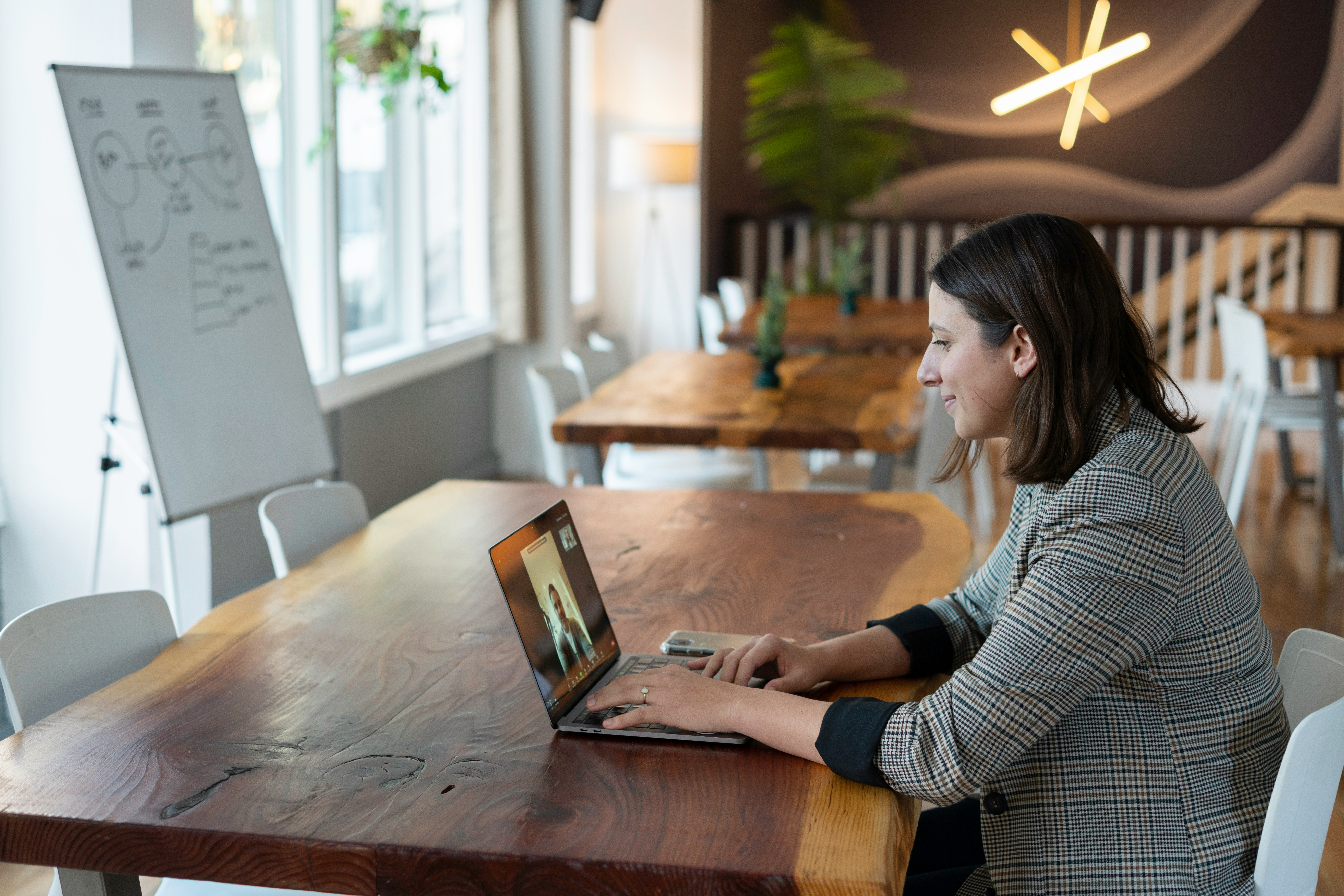 Woman sitting at desk on video call